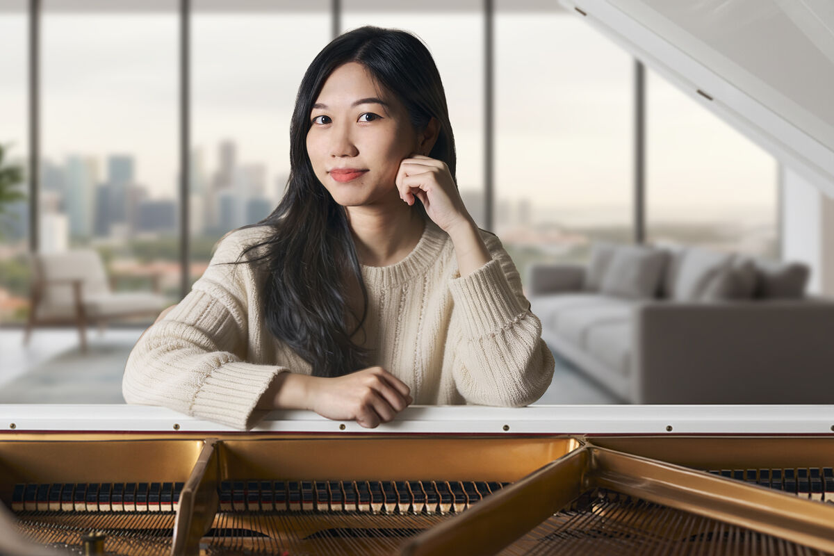 Pat - Piano Teacher in Singapore at the grand piano